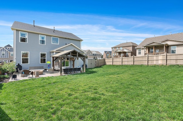 7025 Bennett Dr, Mount Juliet, TN 37122 - back of property with a fenced backyard, a residential view, a patio, a lawn, and a gazebo