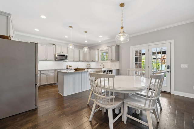 124 Houghland St, Gallatin, TN 37066 - dining area featuring baseboards, ornamental molding, dark wood-type flooring, and recessed lighting