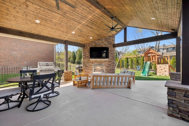 124 Houghland St, Gallatin, TN 37066 - view of patio / terrace featuring a grill, fence, a ceiling fan, an outdoor living space with a fireplace, and area for grilling