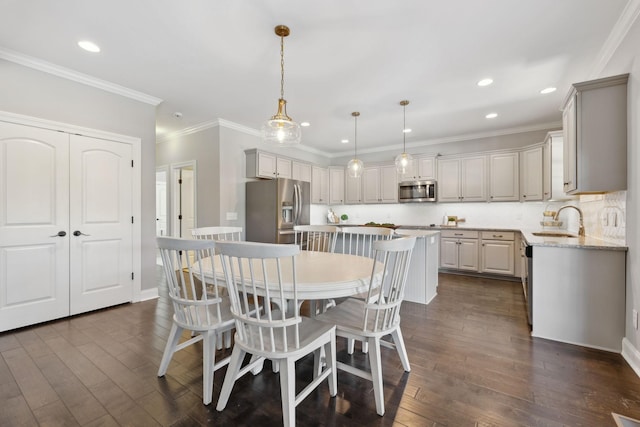124 Houghland St, Gallatin, TN 37066 - dining space featuring baseboards, dark wood-style flooring, crown molding, and recessed lighting