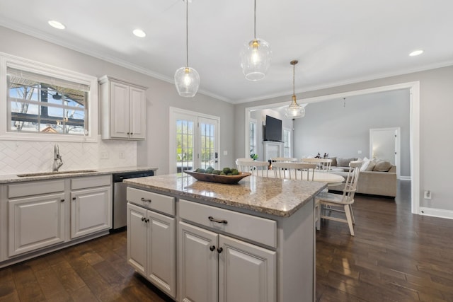 124 Houghland St, Gallatin, TN 37066 - kitchen with dark wood finished floors, dishwasher, a sink, a center island, and decorative backsplash