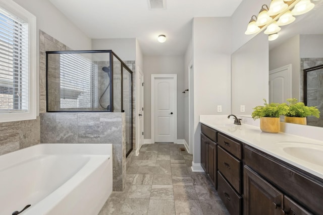124 Houghland St, Gallatin, TN 37066 - full bathroom with a bath, visible vents, a stall shower, and a notable chandelier
