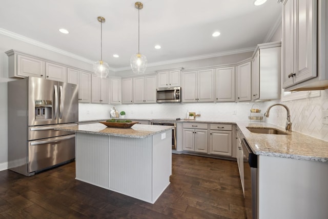 124 Houghland St, Gallatin, TN 37066 - kitchen featuring dark wood-style floors, a sink, light stone counters, a kitchen island, and appliances with stainless steel finishes