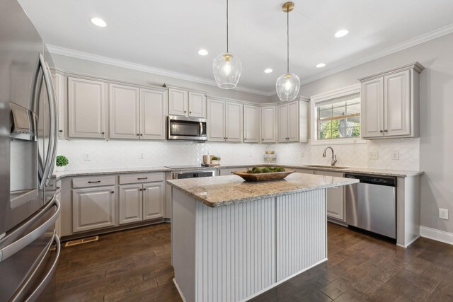 124 Houghland St, Gallatin, TN 37066 - kitchen with dark wood-type flooring, tasteful backsplash, stainless steel appliances, and a sink