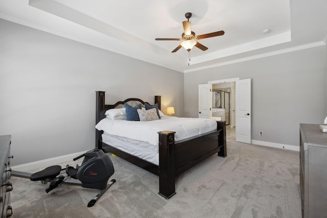 124 Houghland St, Gallatin, TN 37066 - bedroom featuring crown molding, connected bathroom, a tray ceiling, light colored carpet, and baseboards