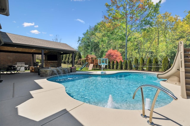 124 Houghland St, Gallatin, TN 37066 - view of swimming pool featuring a patio area, fence, an outdoor stone fireplace, a fenced in pool, and a water slide