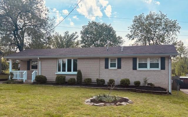 474 Sunliner Dr, Nashville, TN 37209 - ranch-style home featuring covered porch and a front lawn
