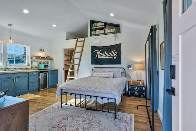 474 Sunliner Dr, Nashville, TN 37209 - bedroom featuring beverage cooler, a sink, lofted ceiling, and light wood-style floors