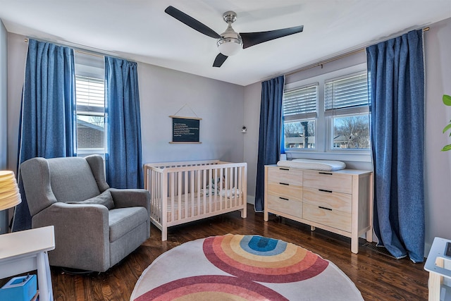 474 Sunliner Dr, Nashville, TN 37209 - bedroom with a crib, a ceiling fan, and wood finished floors