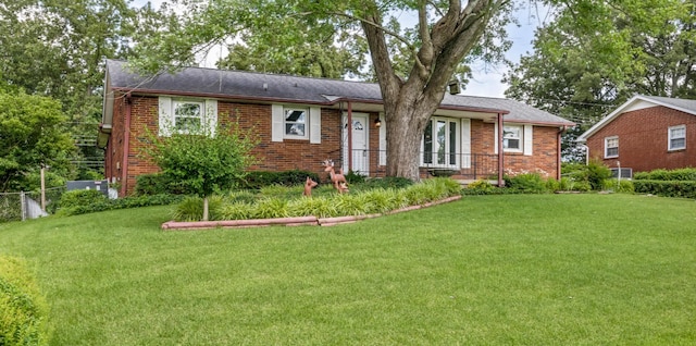 208 Orleans Dr, Clarksville, TN 37042 - ranch-style house featuring a front yard and brick siding