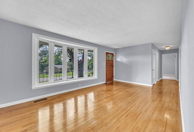 208 Orleans Dr, Clarksville, TN 37042 - empty room featuring a textured ceiling and light wood finished floors