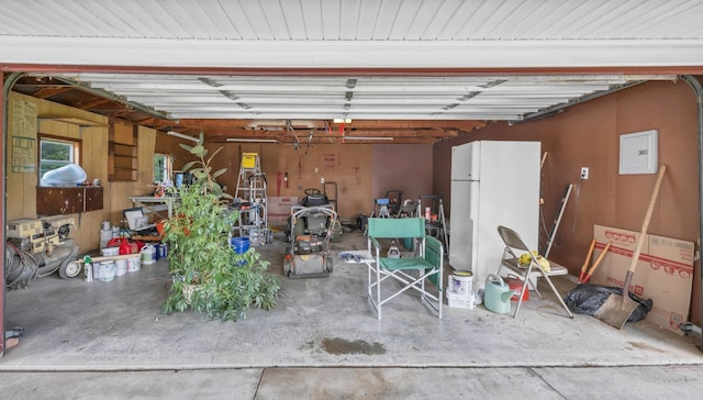 208 Orleans Dr, Clarksville, TN 37042 - garage featuring electric panel and freestanding refrigerator