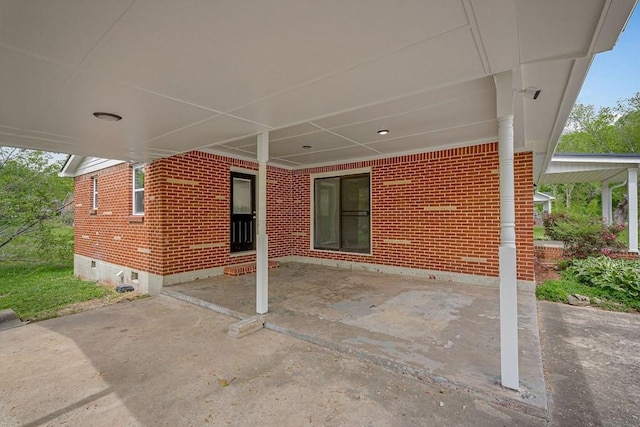 view of patio / terrace with an attached carport