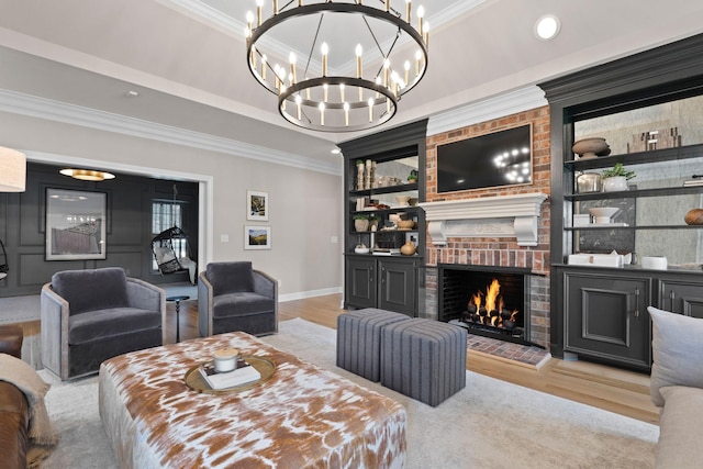 2931 Longford Dr, Murfreesboro, TN 37129 - living room with wood finished floors, a fireplace, a notable chandelier, and crown molding