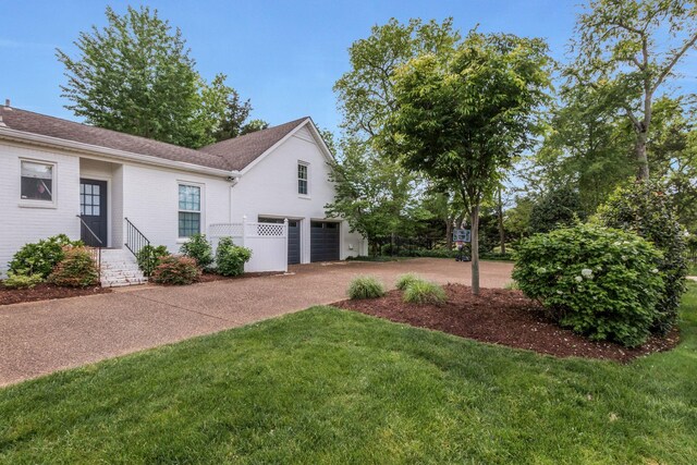 2931 Longford Dr, Murfreesboro, TN 37129 - view of front of property with driveway, roof with shingles, a front yard, and a garage