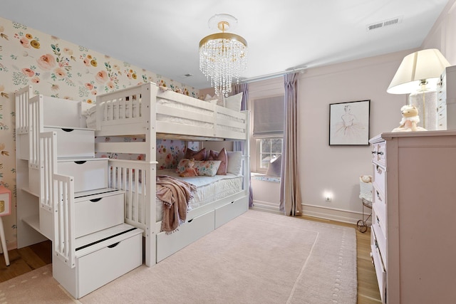 2931 Longford Dr, Murfreesboro, TN 37129 - bedroom featuring wallpapered walls, wood finished floors, visible vents, baseboards, and a notable chandelier