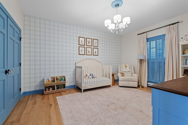 2931 Longford Dr, Murfreesboro, TN 37129 - bedroom featuring wallpapered walls, light wood finished floors, baseboards, and a notable chandelier