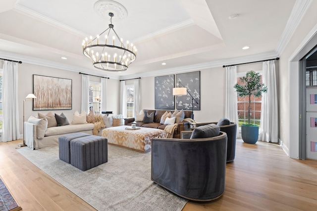 2931 Longford Dr, Murfreesboro, TN 37129 - living area with wood finished floors, a notable chandelier, a raised ceiling, and crown molding