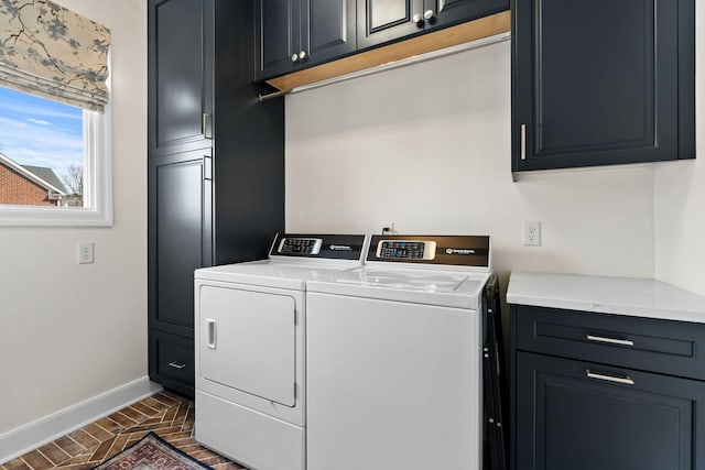 2931 Longford Dr, Murfreesboro, TN 37129 - clothes washing area featuring washing machine and clothes dryer, brick floor, baseboards, and cabinet space