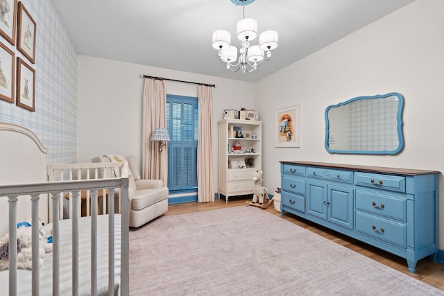 2931 Longford Dr, Murfreesboro, TN 37129 - bedroom featuring a chandelier, wallpapered walls, wood finished floors, and a crib
