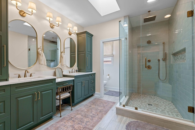 2931 Longford Dr, Murfreesboro, TN 37129 - full bathroom with toilet, a stall shower, a skylight, wood finished floors, and vanity