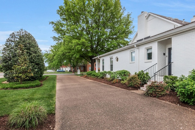 2931 Longford Dr, Murfreesboro, TN 37129 - exterior space with a chimney and brick siding