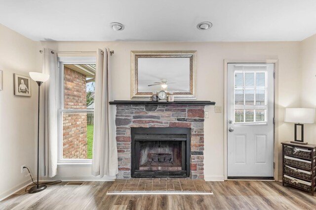 1646 S Jordan Dr, Clarksville, TN 37042 - living area with a fireplace, healthy amount of natural light, and wood finished floors