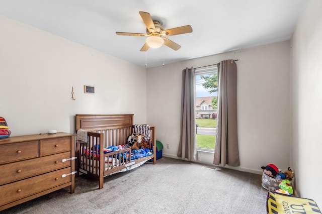 1646 S Jordan Dr, Clarksville, TN 37042 - bedroom with light carpet, a crib, baseboards, and ceiling fan
