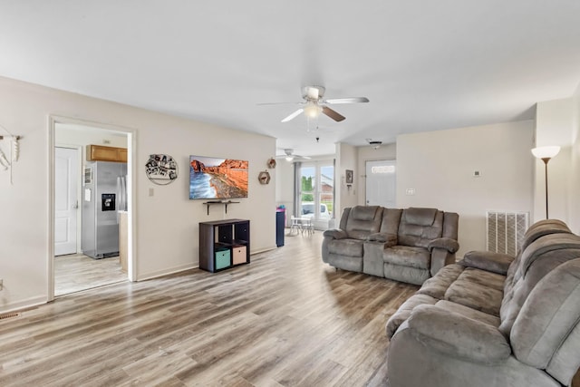 1646 S Jordan Dr, Clarksville, TN 37042 - living room with ceiling fan, light wood-style floors, and baseboards