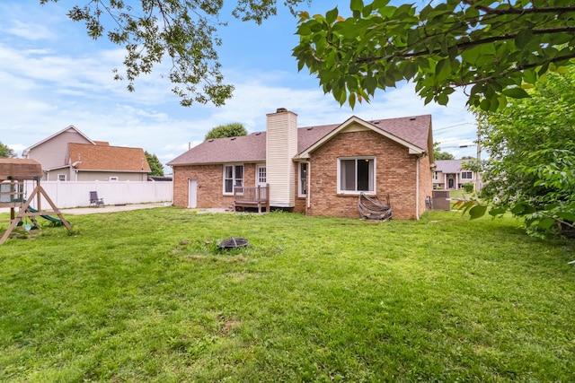 1646 S Jordan Dr, Clarksville, TN 37042 - rear view of house with brick siding, a chimney, and roof with shingles