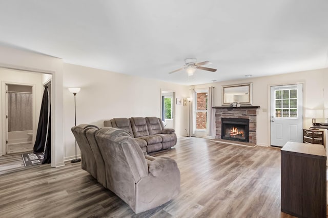 1646 S Jordan Dr, Clarksville, TN 37042 - living area with a ceiling fan, healthy amount of natural light, wood finished floors, and a fireplace