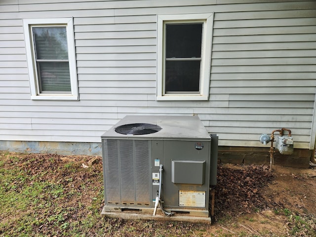 details featuring central AC unit and gas meter
