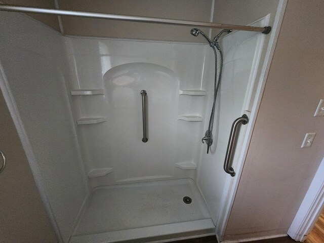 bathroom with a shower stall