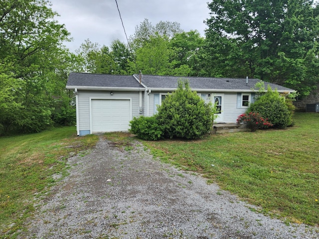 single story home with an attached garage, dirt driveway, and a front yard