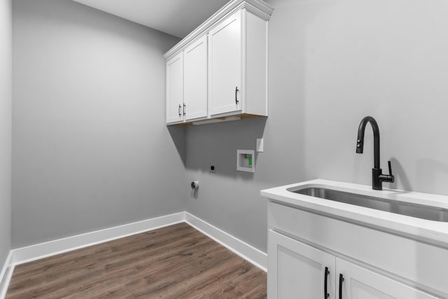 1048 Veridian Dr B, Clarksville, TN 37043 - clothes washing area with hookup for a washing machine, a sink, electric dryer hookup, cabinet space, and dark wood-style floors