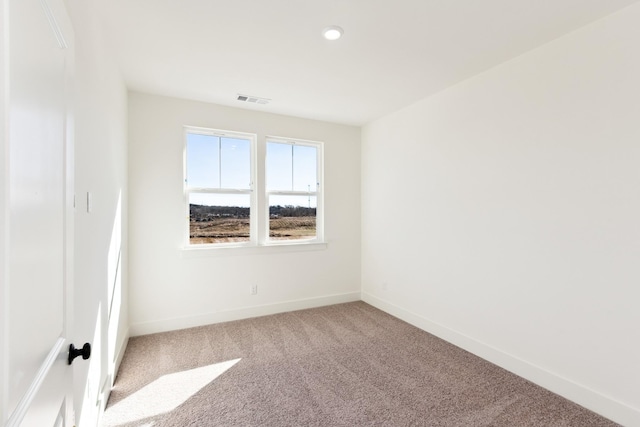 unfurnished room with recessed lighting, baseboards, visible vents, and carpet