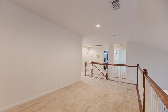 unfurnished room with baseboards, carpet flooring, visible vents, and recessed lighting