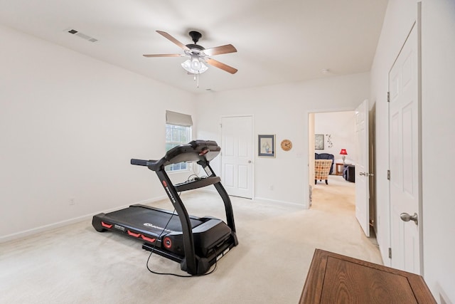 workout area with light carpet, baseboards, visible vents, and ceiling fan