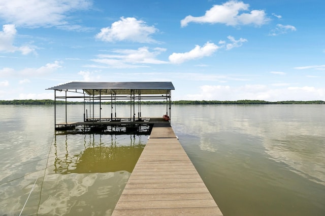 view of dock featuring boat lift and a water view