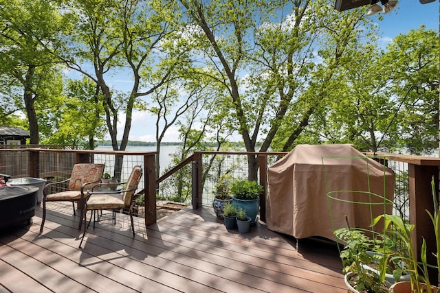 wooden terrace with a water view