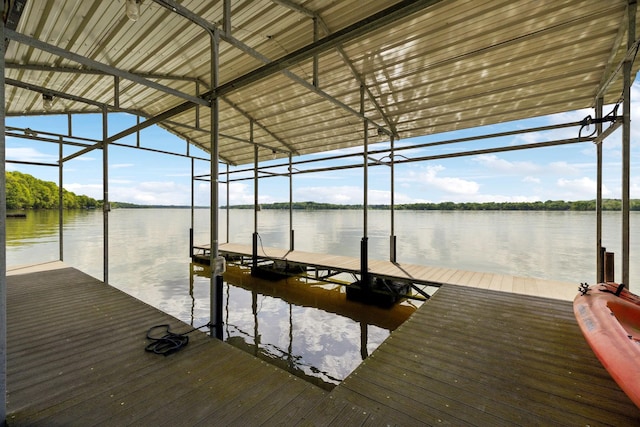 view of dock featuring boat lift and a water view