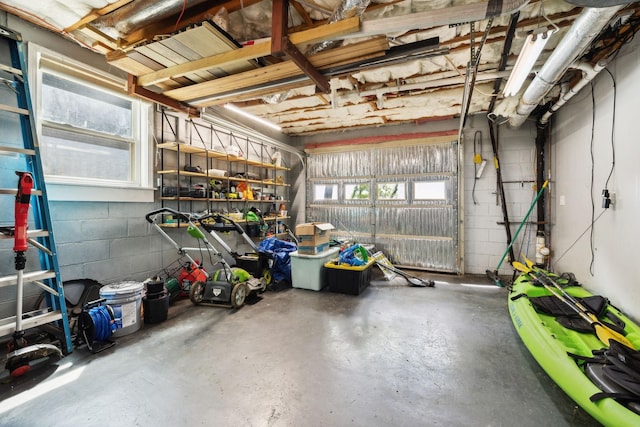 garage with concrete block wall