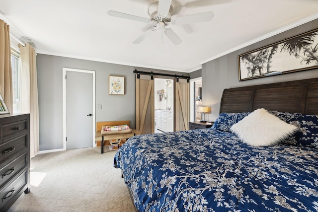 carpeted bedroom featuring a barn door, ceiling fan, baseboards, and ornamental molding