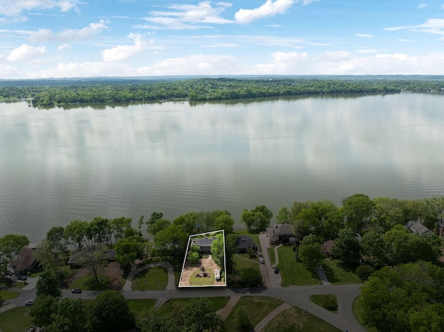 bird's eye view with a view of trees and a water view