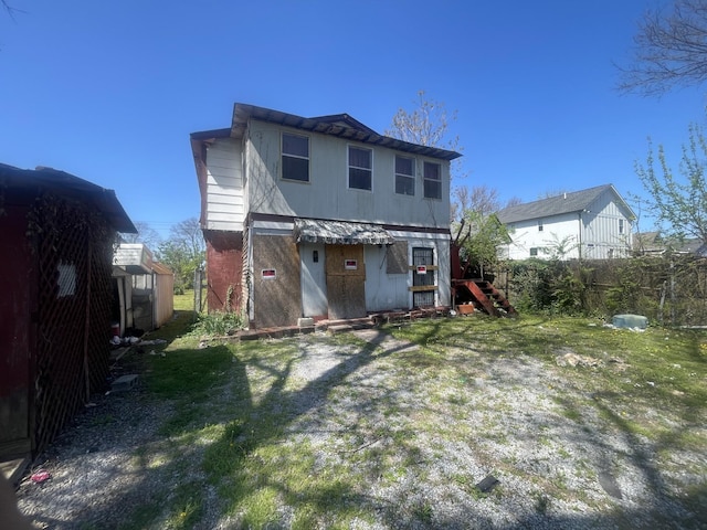 back of property with fence