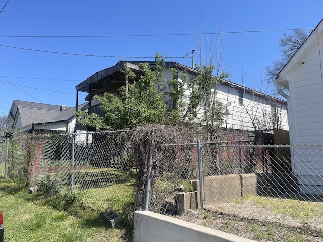 view of side of home with fence