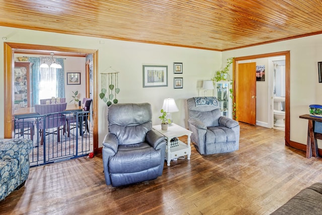 living area with baseboards, a chandelier, wood finished floors, wood ceiling, and ornamental molding