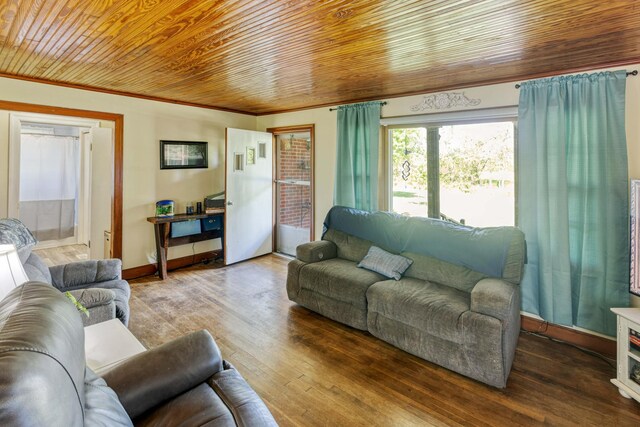 living room with wooden ceiling, baseboards, crown molding, and hardwood / wood-style floors