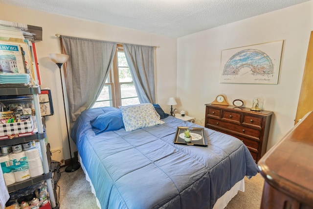 carpeted bedroom featuring a textured ceiling