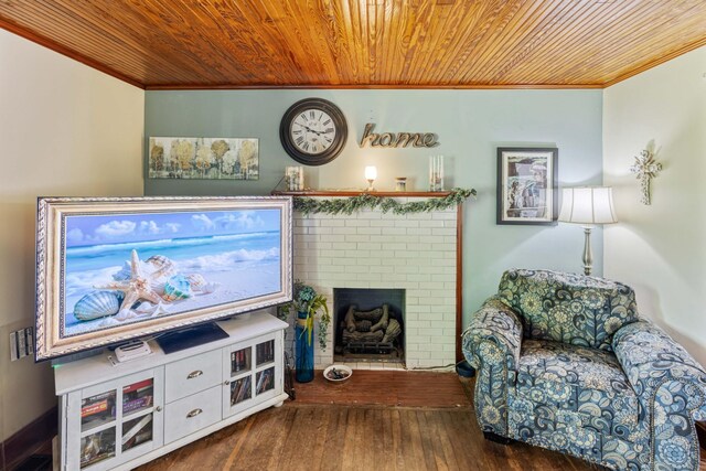 living room with a fireplace, wood-type flooring, crown molding, and wood ceiling
